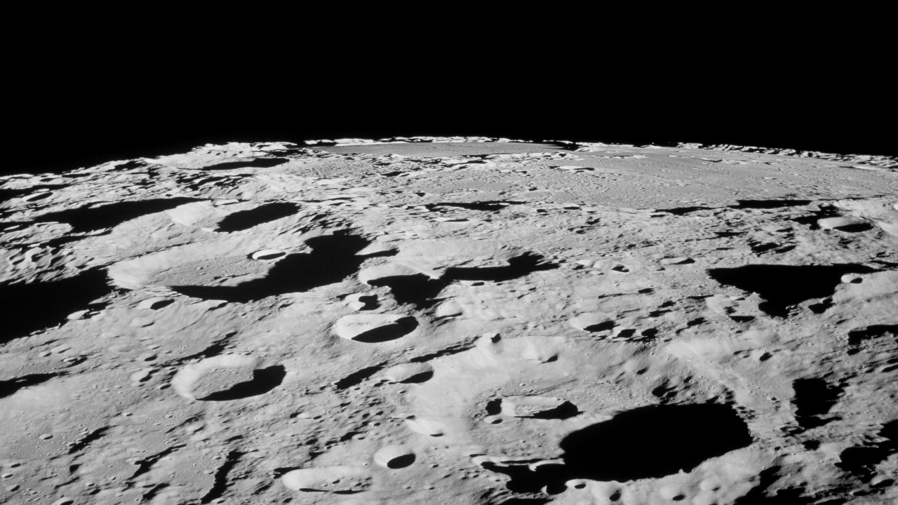View towards the Moon's horizon, with many overlapping craters. 