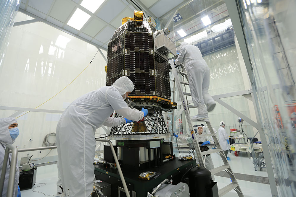 NASA's Lunar Atmosphere and Dust Environment Explorer (LADEE) spacecraft being prepared in the clean room at Wallops Flight Facility.