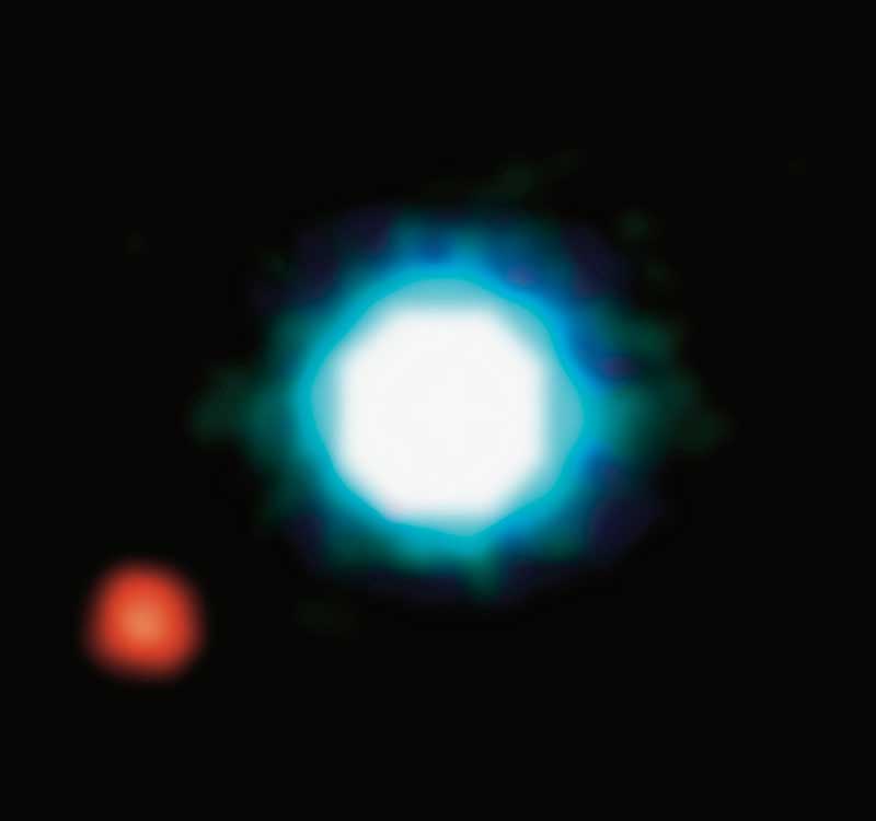 A smaller planet is seen as a red sphere near a brighter, white-blue light of the much larger star.
