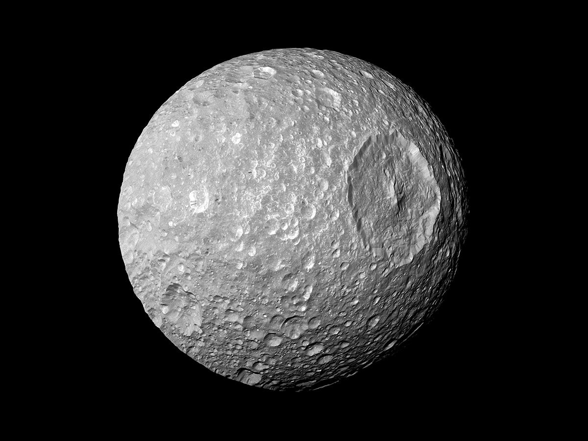 In this view captured by NASA's Cassini spacecraft on its closest-ever flyby of Saturn's moon Mimas, large Herschel Crater dominates Mimas, making the moon look like the Death Star in the movie "Star Wars."