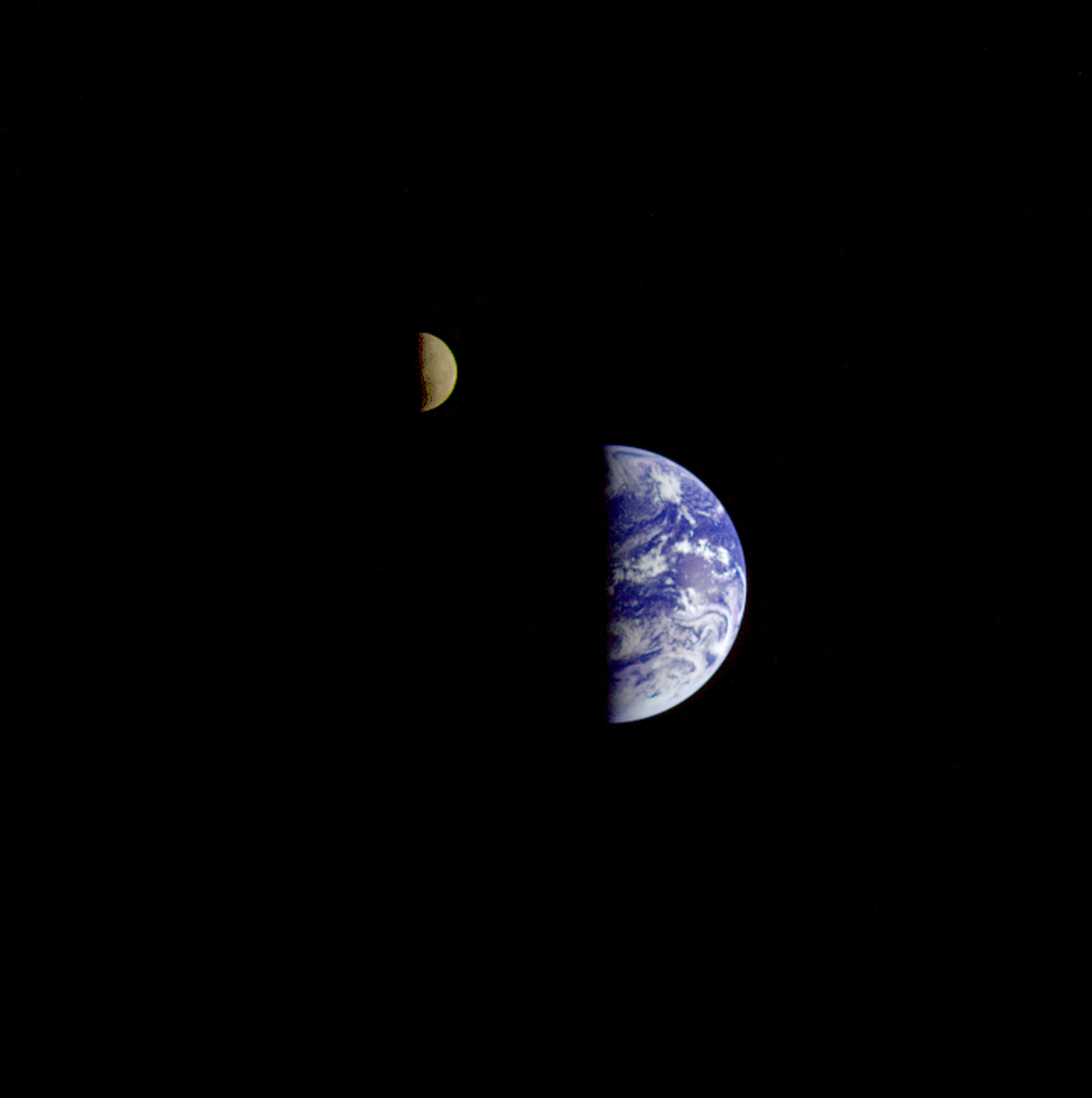 Eight days after its final encounter with the Earth, the Galileo spacecraft looked back and captured this remarkable view of the Earth and Moon.