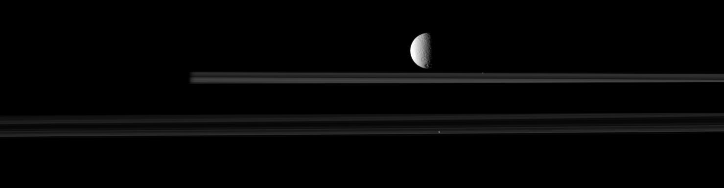 The moon Tethys is upstaged by two smaller moons in this movie from Cassini.