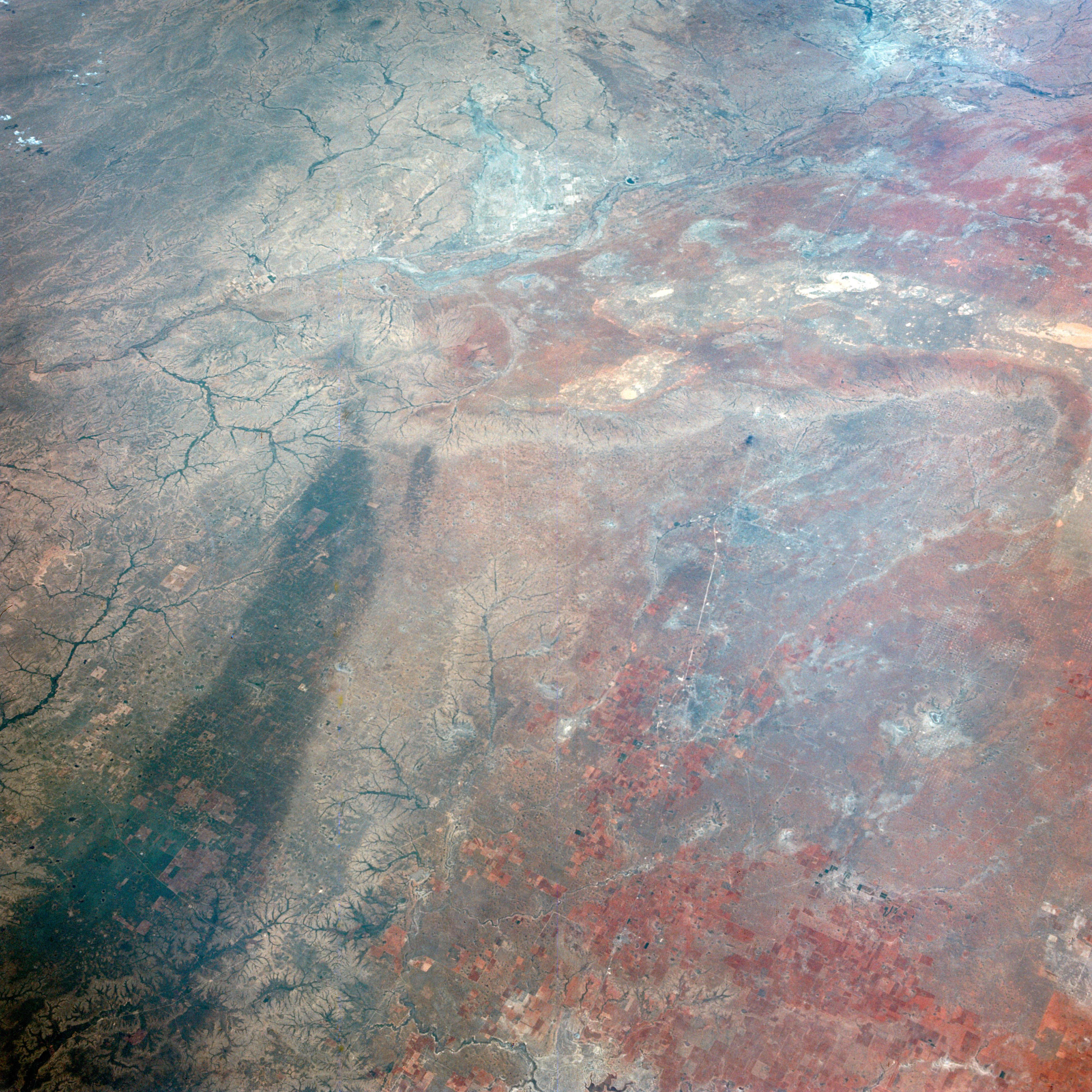 This image of Texas, obtained by astronauts aboard NASA's Gemini 4 spacecraft on June 5, 1965, shows a large dark swath attributed to rainfall.
