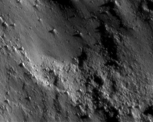 NEAR Shoemaker took this picture at 8:45 p.m. EST on January 25, 2001, during one of the spacecraft's low-altitude passes over the surface of Eros.