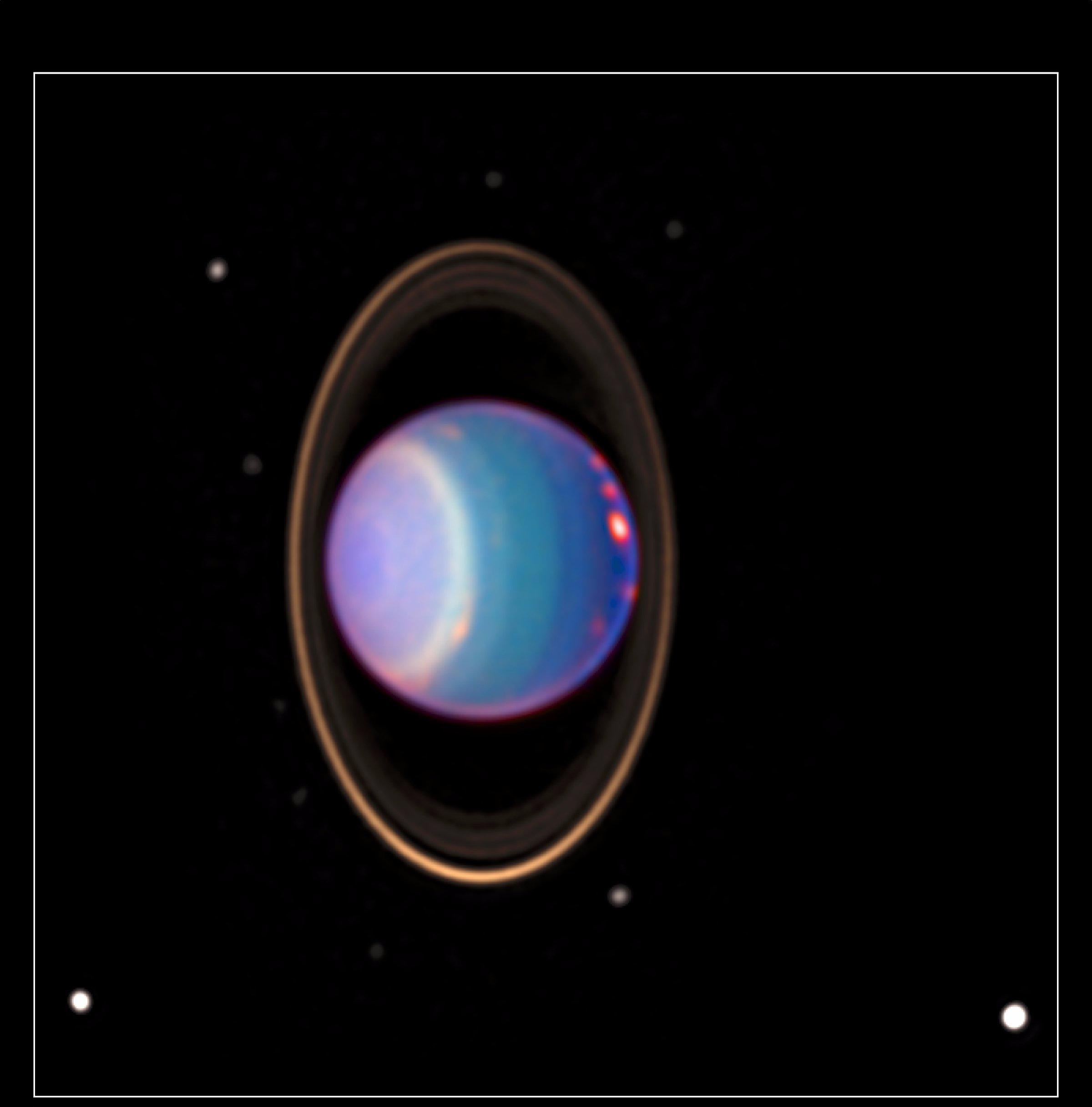 A recent Hubble Space Telescope view reveals Uranus surrounded by its four major rings and by 10 of its 17 known satellites.