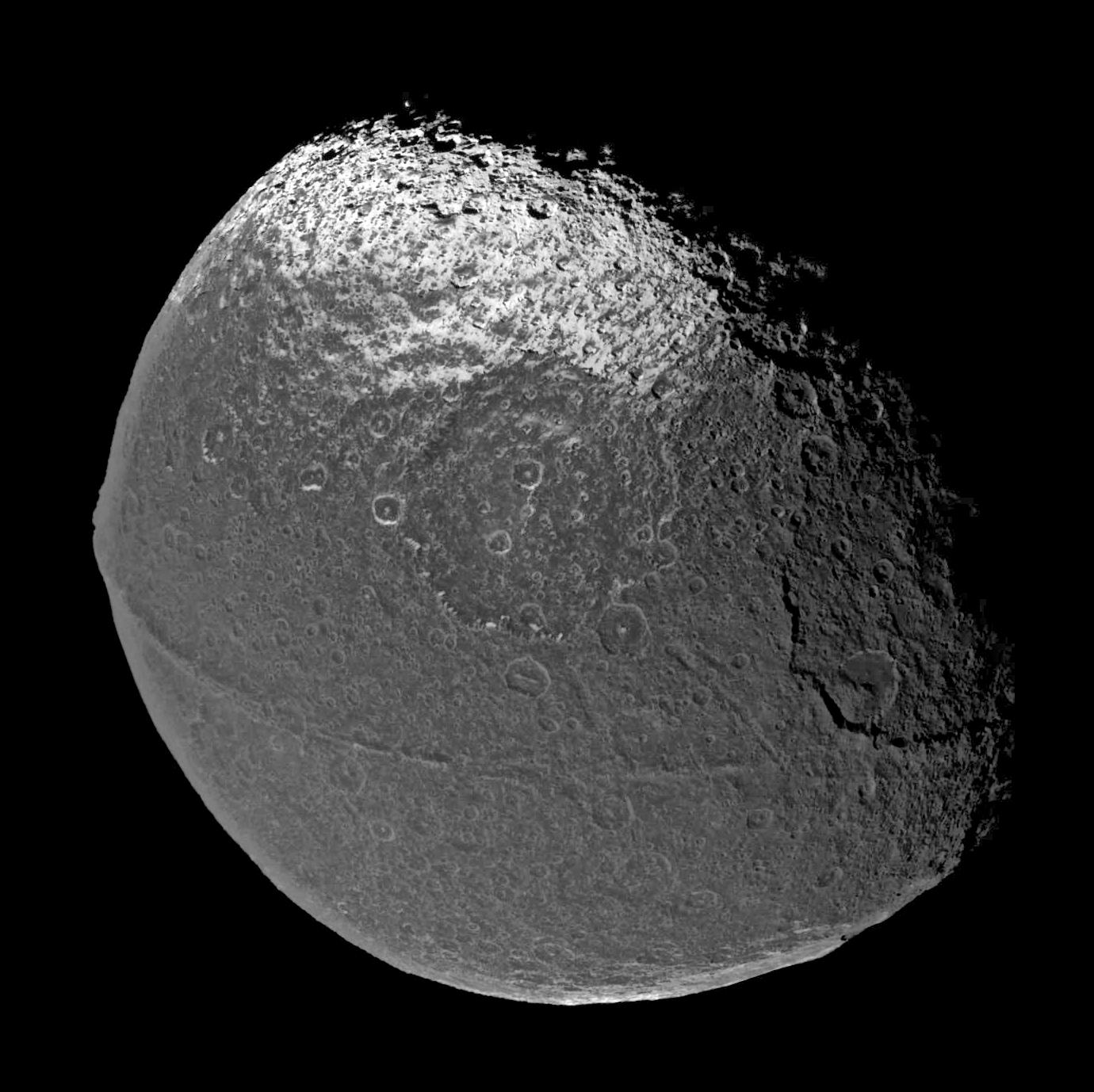On New Year's Eve 2004, Cassini flew past Saturn's intriguing moon Iapetus, capturing the four visible light images that were put together to form this global view.