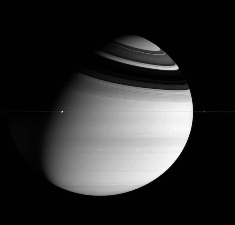 Saturn, the extremely thin rings, and two moons