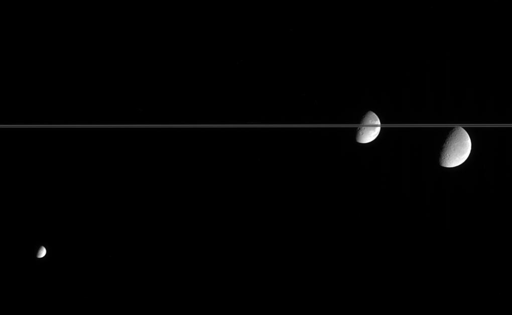 Three of Saturn's moon near the rings