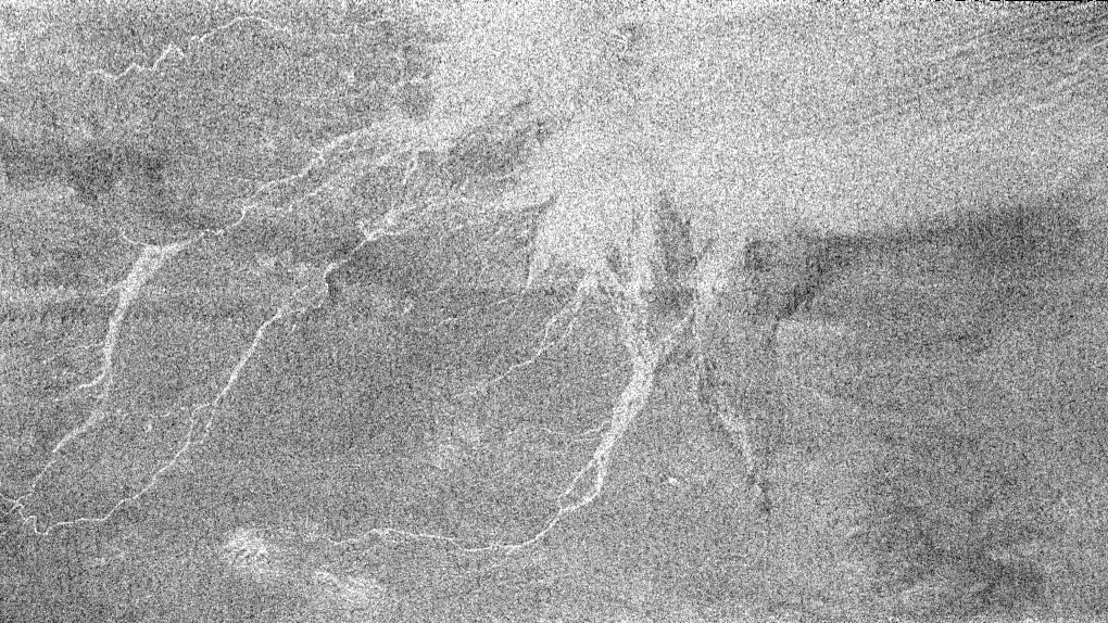 White lines that could be channels in which fluid flowed from the slopes of Circus Maximus on Titan