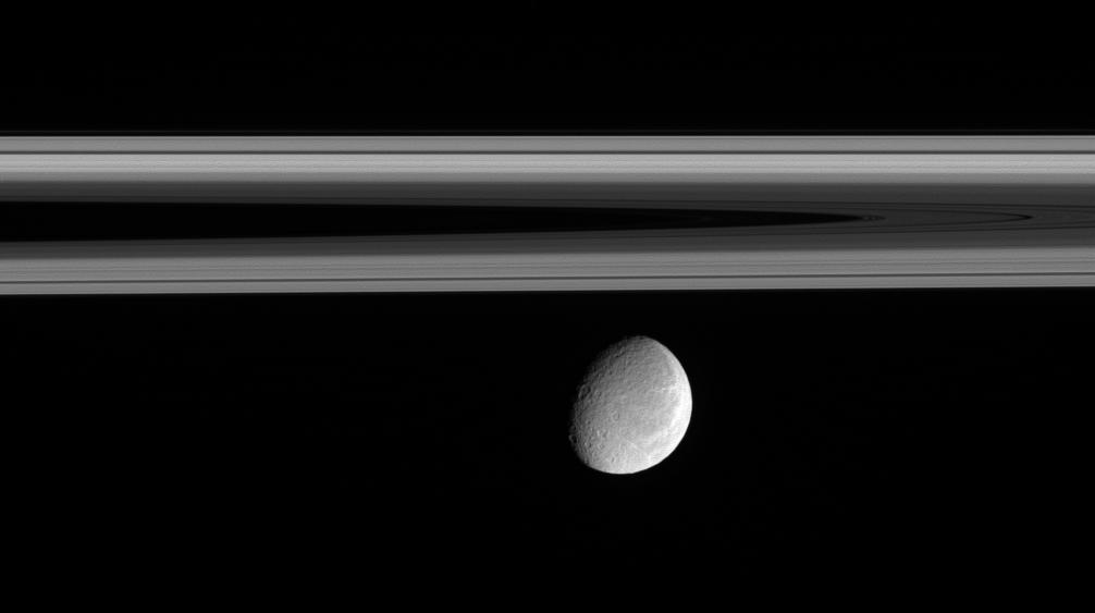 Rhea floats below the innermost regions of Saturn's amazing rings.