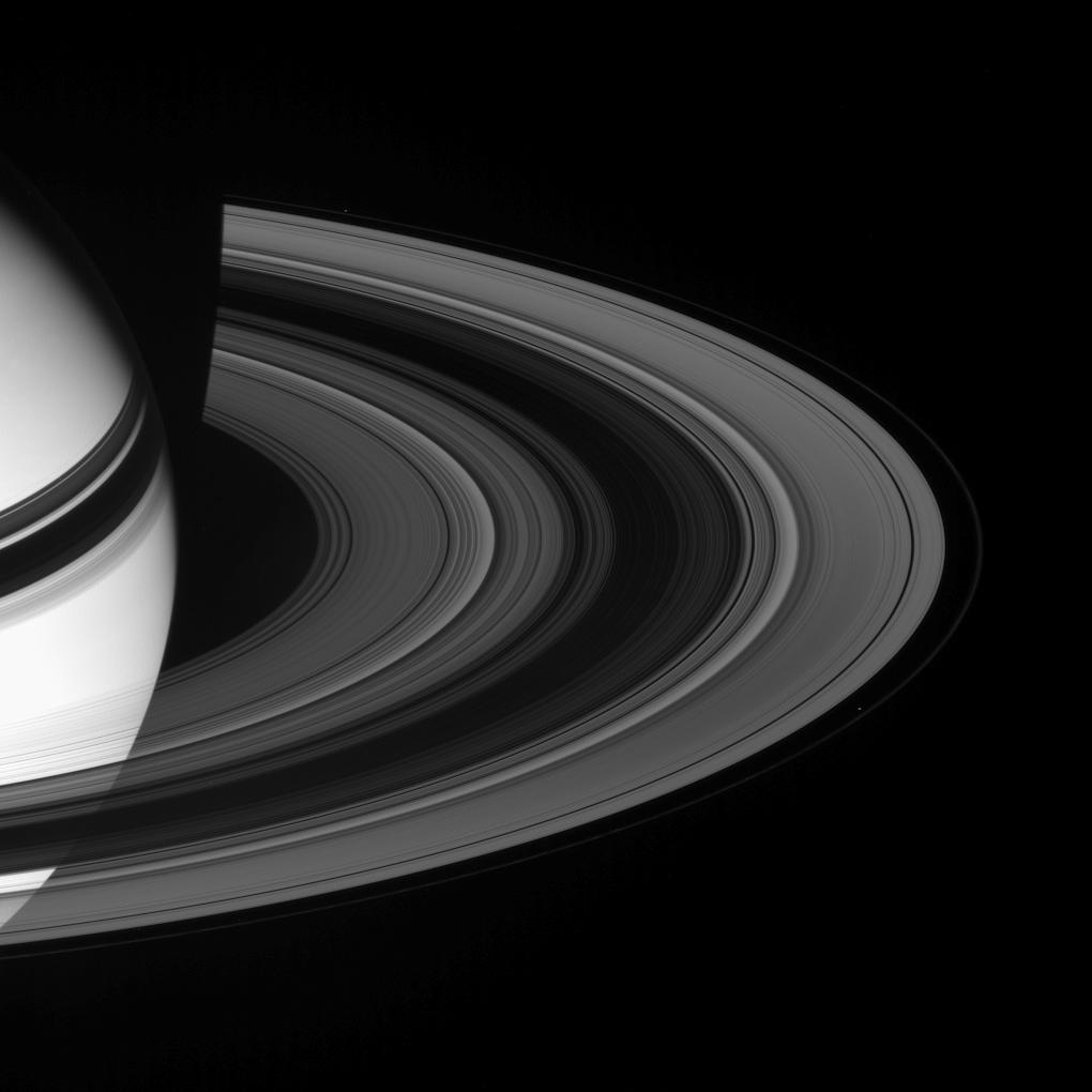 Saturn, it's rings, and the moons Prometheus and Pandora