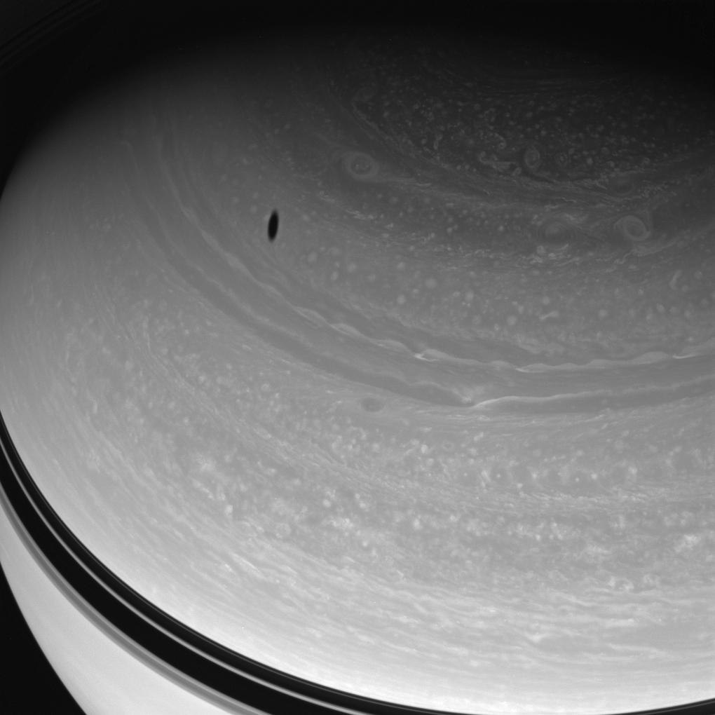 Saturn's northern latitudes and Dione's shadow