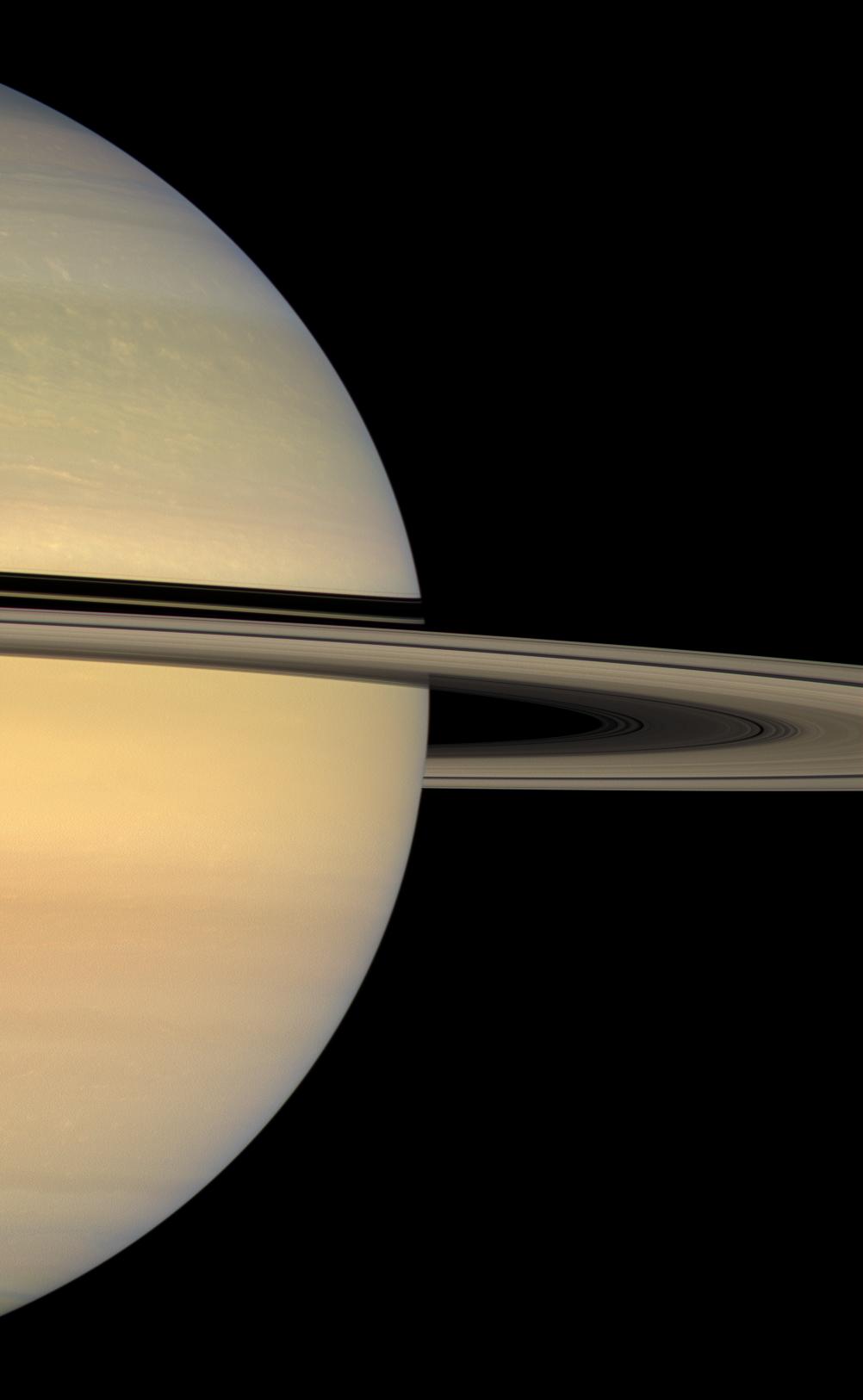 sunlit face of Saturn's rings, whose shadows continue to slide southward on the planet