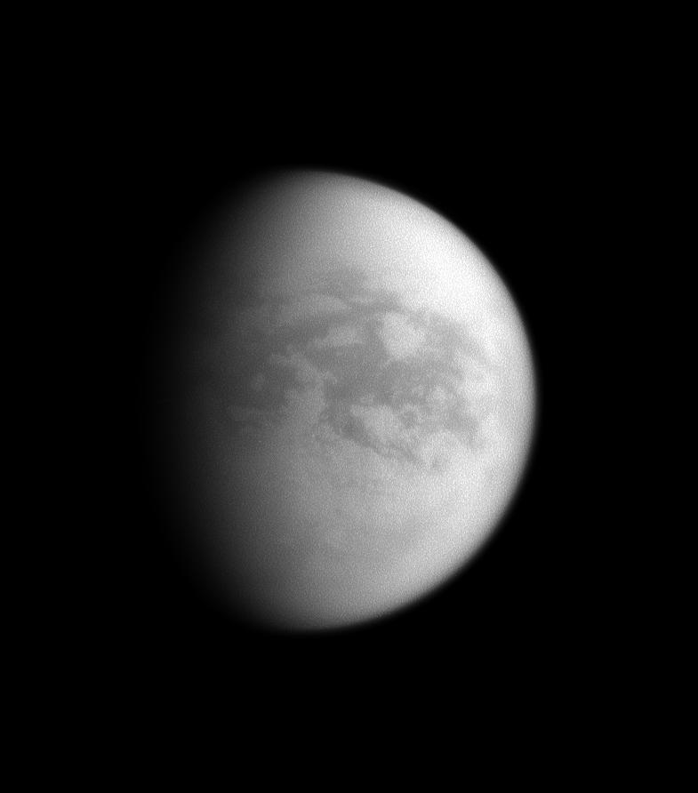 The sun illuminates mainly the trailing hemisphere of Saturn's largest moon, Titan.