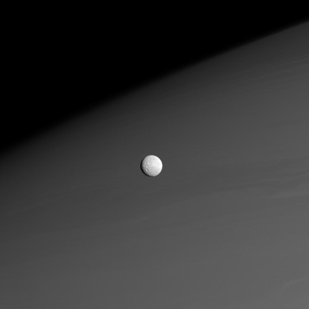 Mimas in front of Saturn