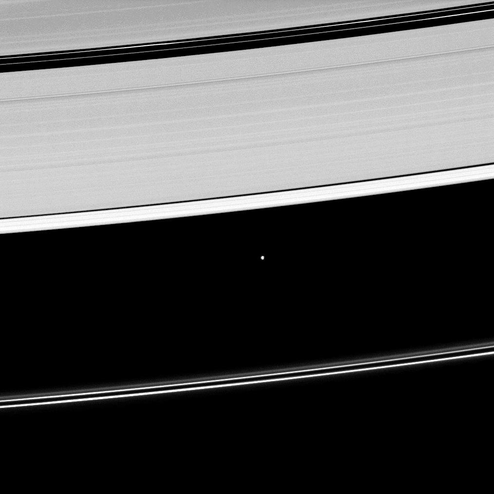 Saturn's moon Atlas, shown at the center of this image, orbits within the Roche Division separating the A ring from the tenuous F ring.