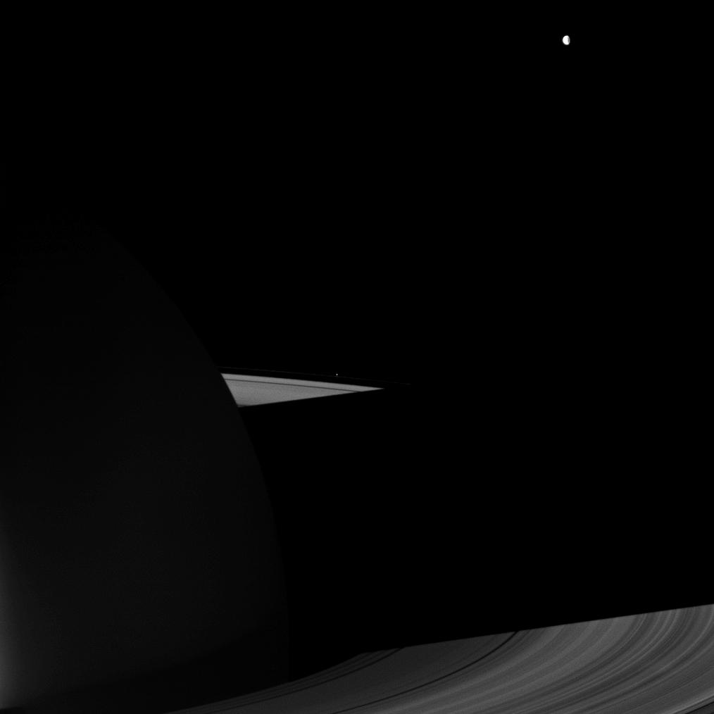 The night side of Saturn, its rings and Dione