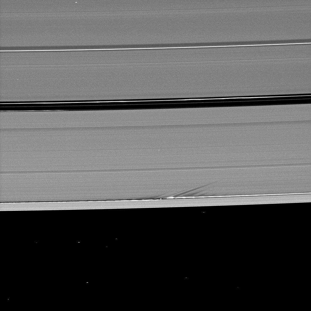 Saturn's rings and waves created by the gravity of the moon Daphnis