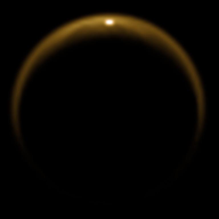 This image shows the first flash of sunlight reflected off a hydrocarbon lake on Saturn's moon Titan.