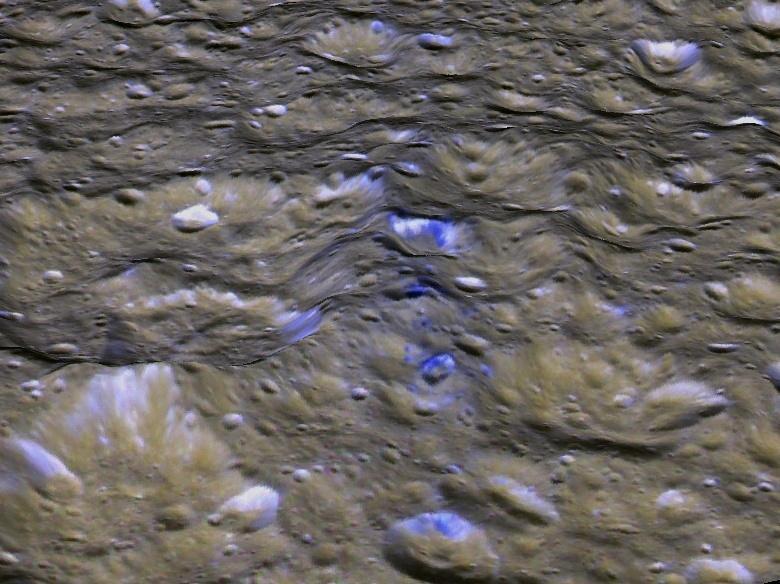 This perspective view shows one of a series of relatively blue patches that form a very narrow band only 10 kilometers wide that straddles Rhea's equator.