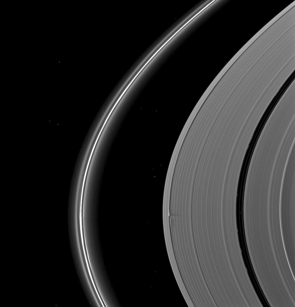 The Cassini spacecraft catches Saturn's moon Daphnis making waves and casting shadows from the narrow Keeler Gap of the planet's A ring in this view taken around the time of Saturn's August 2009 equinox.