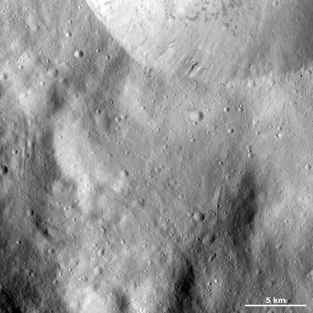 Sharp Crater Rim with Dark Material and Boulders - NASA Science