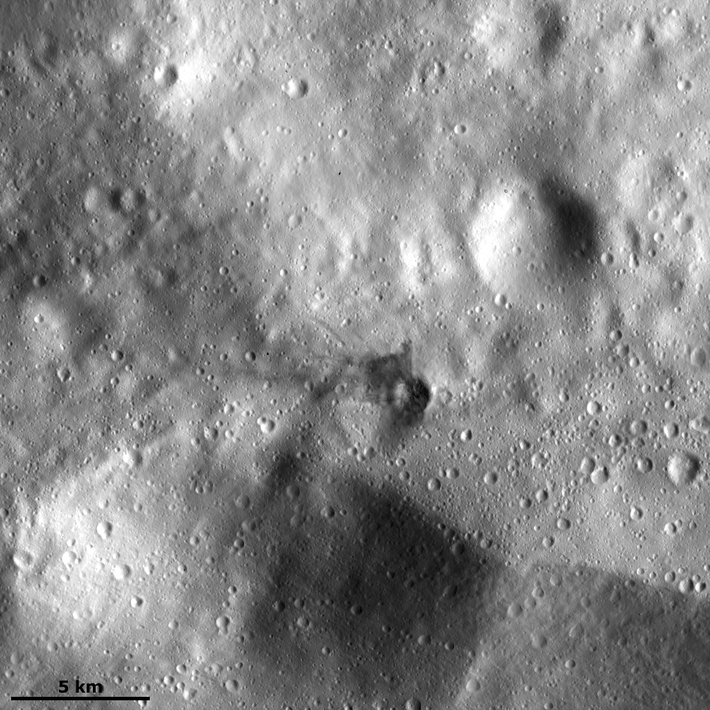Dark Material in the Ejecta of a Small Crater
