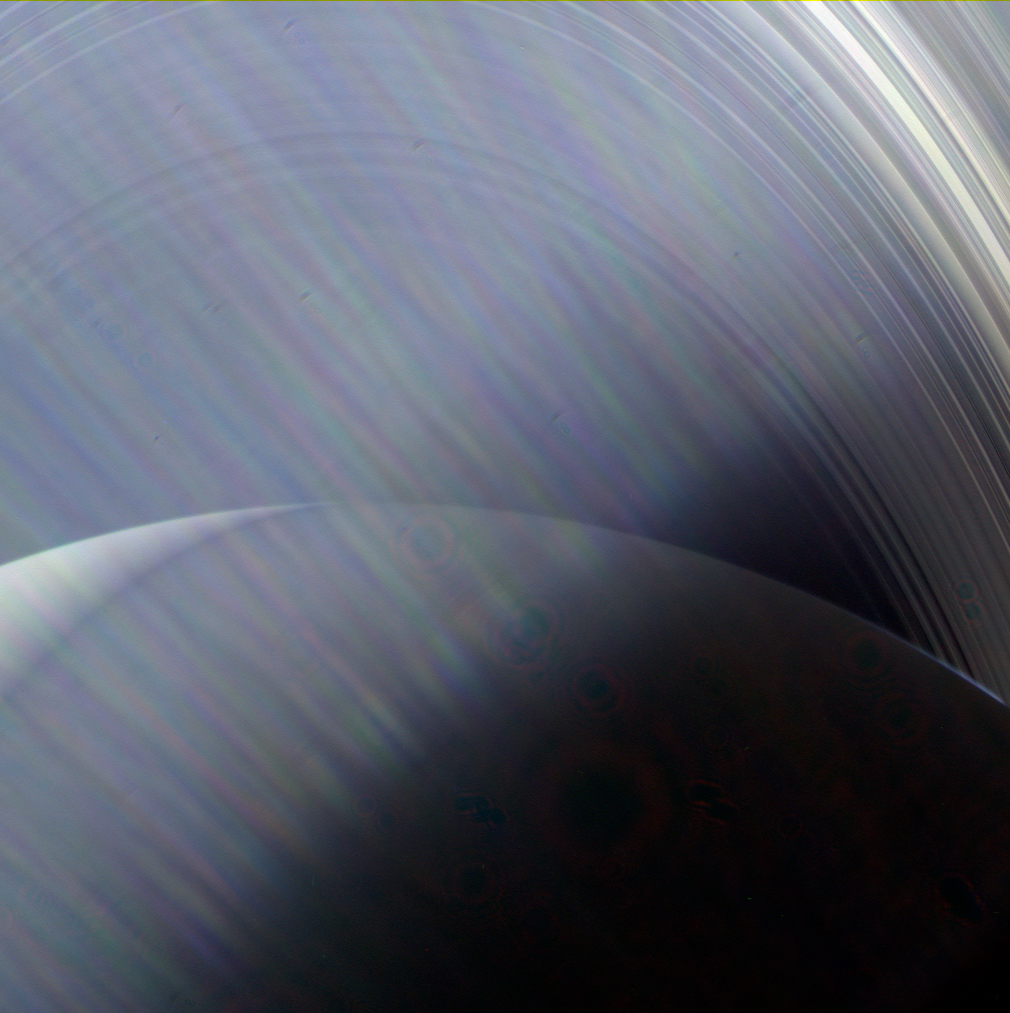 Saturn and the rings through a haze of Sun glare on the camera lens