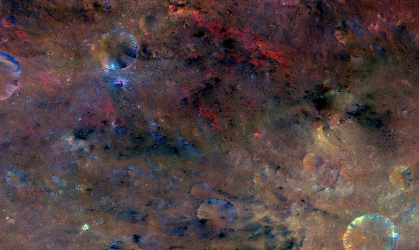 This colorful image from NASA's Dawn mission shows material northwest of the crater Sextilia on the giant asteroid Vesta. Sextilia, located around 30 degrees south latitude, is at the bottom right of this image.