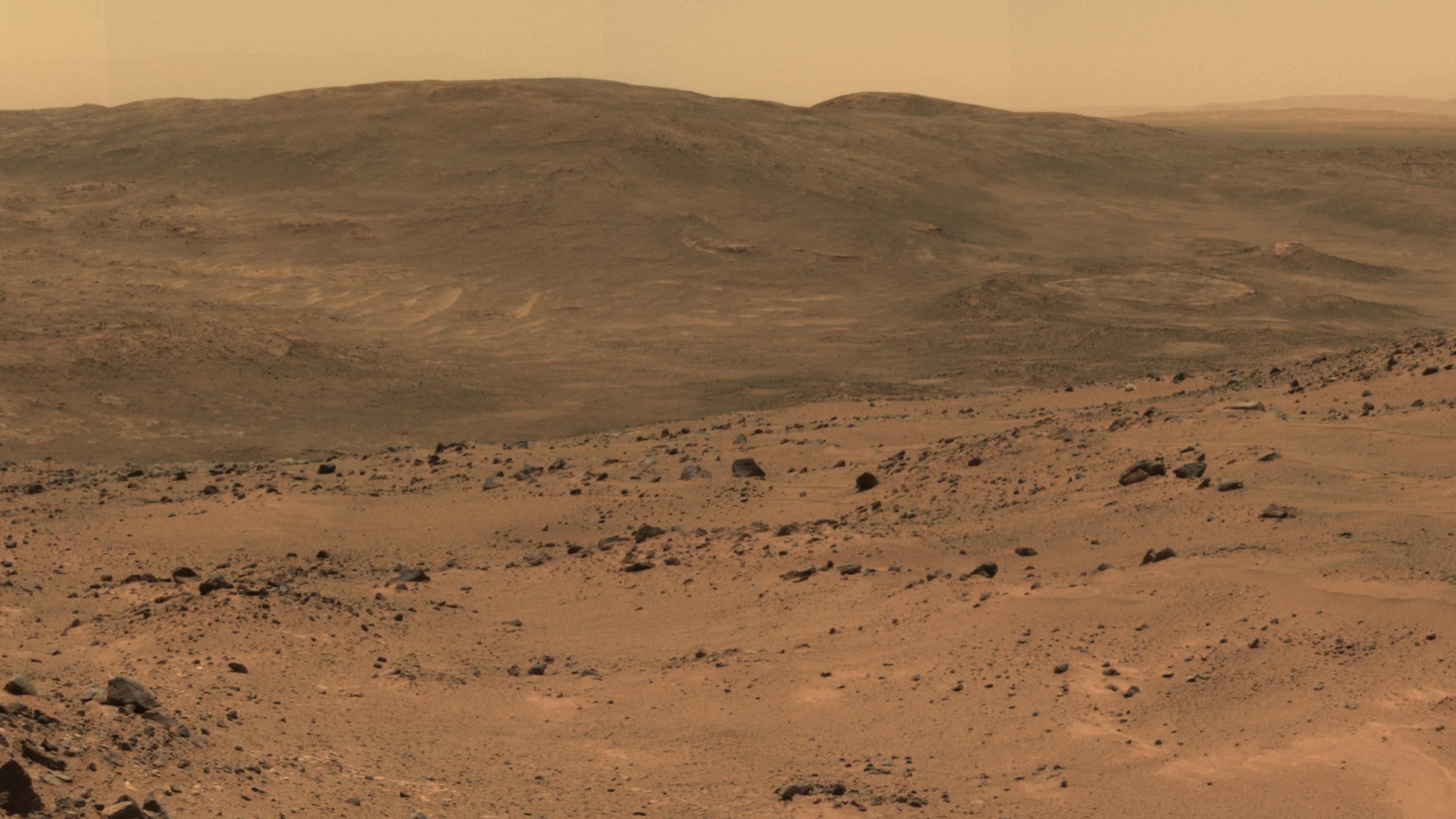 After climbing Husband Hill, Spirit spent more than four years exploring locations within this view, including the "Comanche" outcrop and the "Home Plate" area.