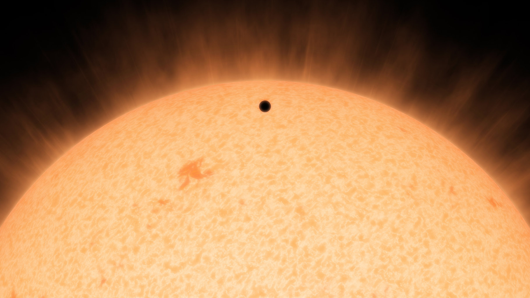 This artist's conception shows the silhouette of a rocky planet, dubbed HD 219134b, as it passes in front of its star. Image credit: NASA/JPL-Caltech