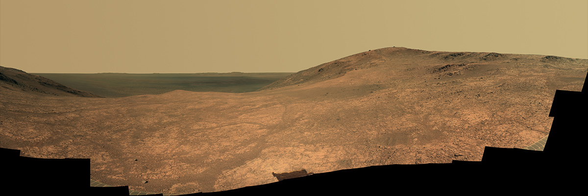 "Marathon Valley" on Mars opens northeastward to a view across the floor of Endeavour Crater in this scene from the panoramic camera (Pancam) of NASA's Mars Exploration Rover Opportunity.