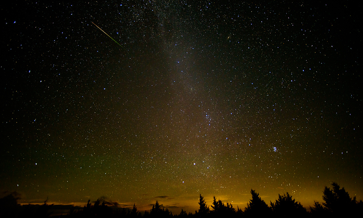 In this 30 second exposure, a meteor streaks across the sky during the annual Perseid meteor shower Friday, Aug. 12, 2016 in Spruce Knob, West Virginia.