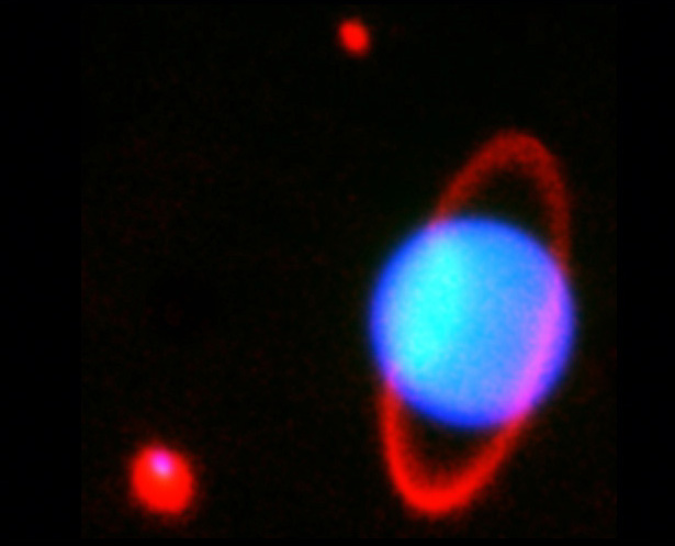 Japan's Subaru Telescope captured this near-infrared image of Uranus and moons Miranda (top center) and Ariel (bottom left).