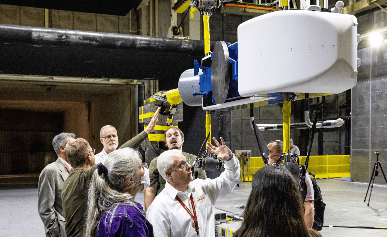 Dragonfly team members review the half-scale lander model.