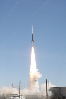 Rocket launching into space from Earth