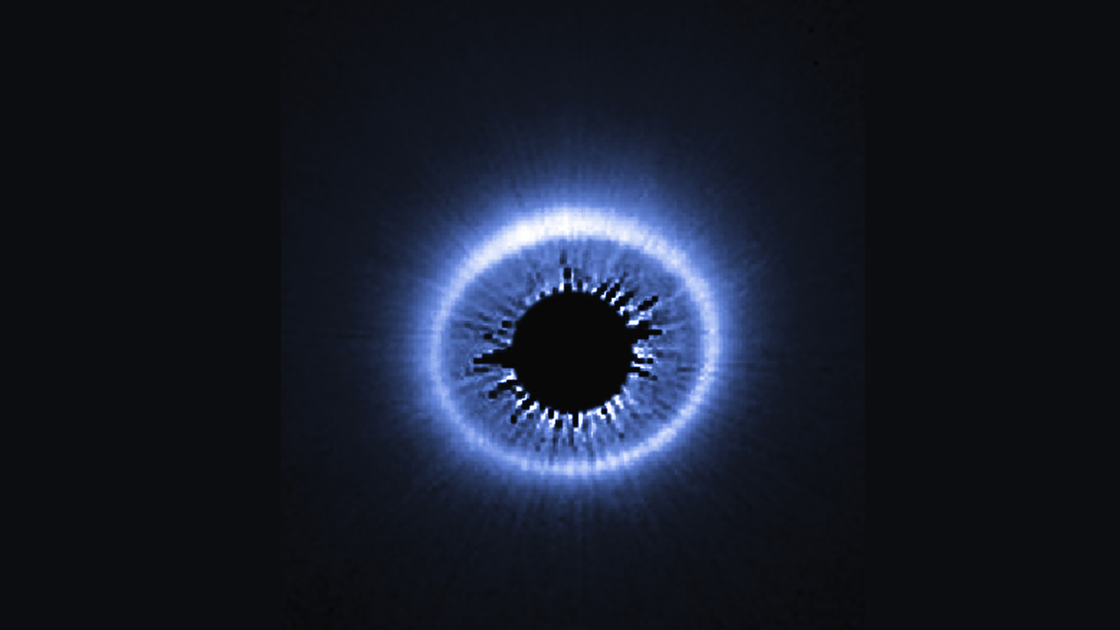 The marked asymmetry of the debris disk around the star HD 181327 suggests it may have formed as a result of the collision of two small bodies. The Disk Detective project aims to discover many other stellar disks using volunteer classifications of data from NASA's WISE mission. Image credit: NASA/ESA/Univ. of Arizona/HST/GO 12228 Team