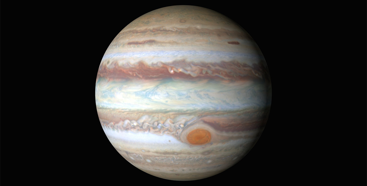 A photo of Jupiter from the Hubble Space Telescope. The map shows Jupiter's Great Red Spot and its striking striated bands of color.