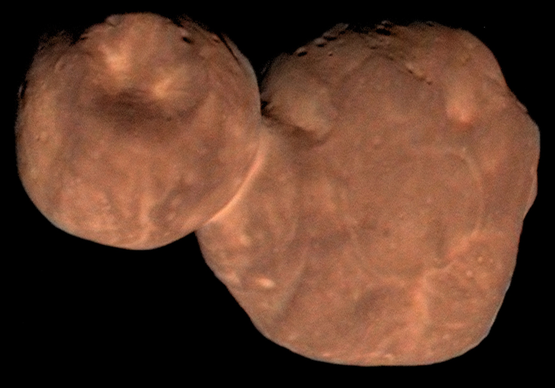 reddish, cratered object with two attached lobes