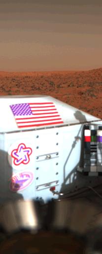 An image of the U.S. flag on the Viking 1 lander on the surface of Mars.