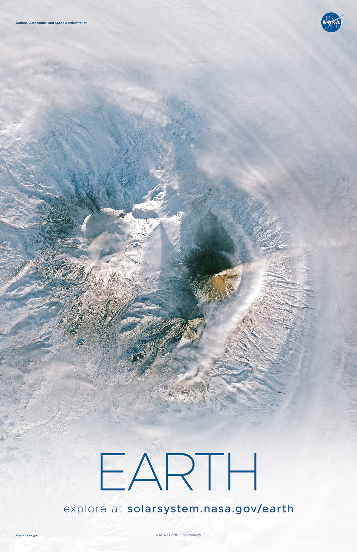 Orbital view of smoking volcano amid snowcapped peaks.