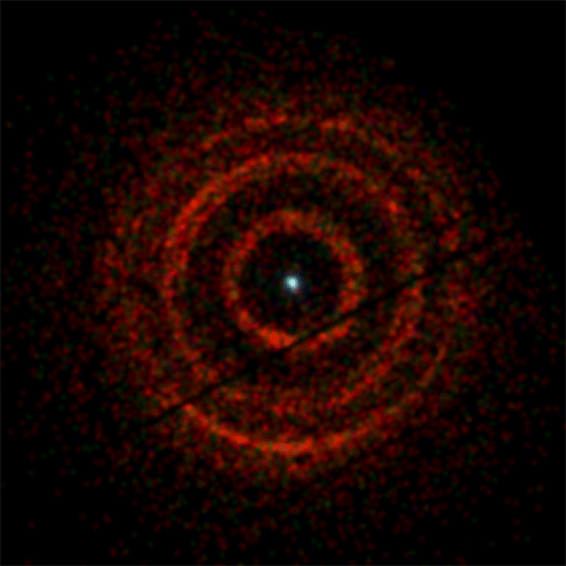 NASA's Neil Gehrels Swift Observatory imaged rings of X-ray light centered on V404 Cygni, a binary system containing an erupting black hole (dot at center), with its X-ray Telescope from June 30 to July 4, 2015. The dark lines running diagonally through the image are artifacts of the imaging system.