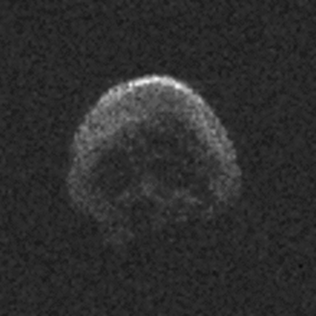 grainy radar image of asteroid that resembles a human skull