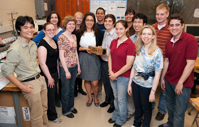 MIT Students pose with their exoplanet-finding CubeSat, scheduled to hitch a ride into space in 2012.