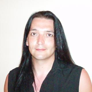 Headshot photo of person with long dark hair