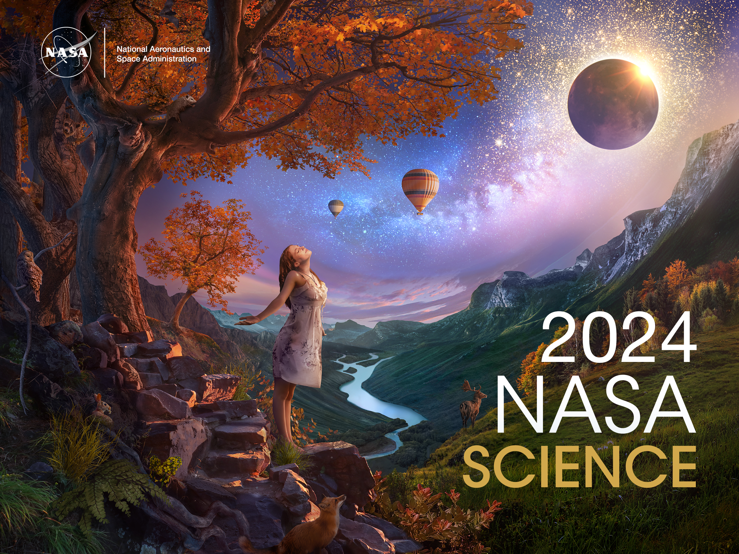 An artist’s concept of a landscape, composed of dusky purples, oranges, golds, and greens. In the left foreground, a young woman wearing a white dress basks in the rays of a solar eclipse. She stands under a bright orange fall tree rooted to the side of a rocky mountain trail. The scene overlooks a valley with a river running through the middle towards distant hazy blue mountains. Nocturnal animals – including a fox, owl, possum, and bat – emerge to investigate the sudden onset of night. A deer stands on a grassy knoll at left in front of a line of fall colored trees. The Milky Way trails across the sky, leading up from the young woman to the eclipse and glittering stars at top right. Two hot air balloons float in the distance. This concept was created in celebration of the Heliophysics Big Year, which is bookended by the Annular Eclipse in October of 2023 and the Total Solar Eclipse in April of 2024.