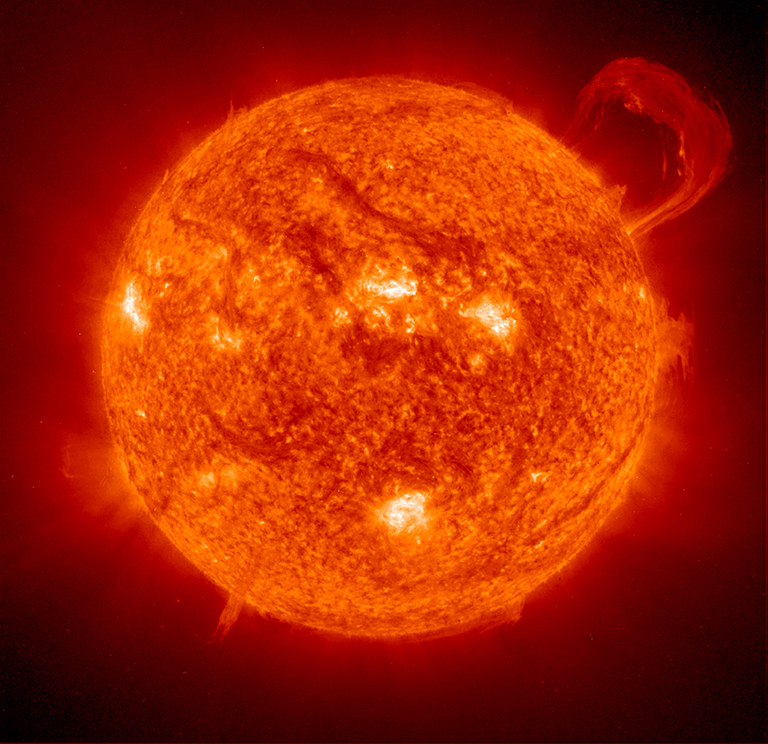 Image of the Sun showing a solar prominence (a large, bright feature extending outward from the Sun's surface). Credit: ESA/NASA