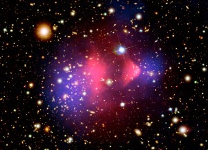 Galaxies dot a black background with only one bright foreground star just above and to the right of image center. Swaths of purple and purple through the center of the galaxy cluster.