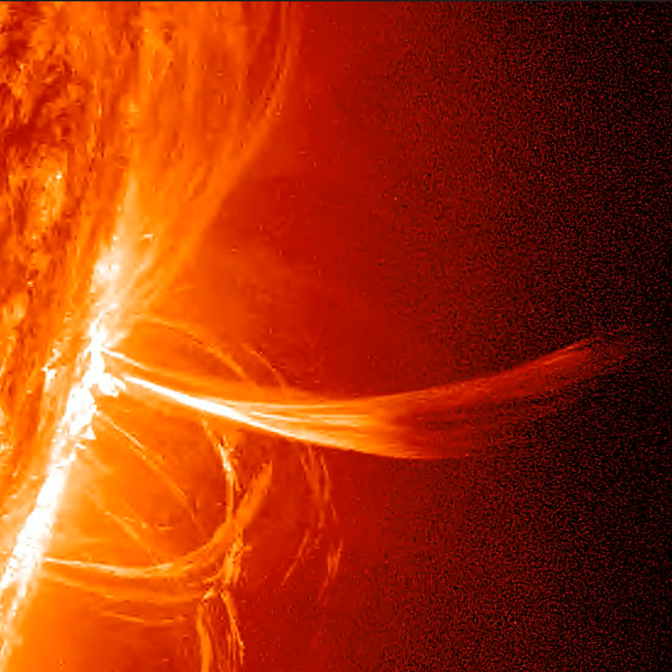 A close up of an orange sun with a large solar flare