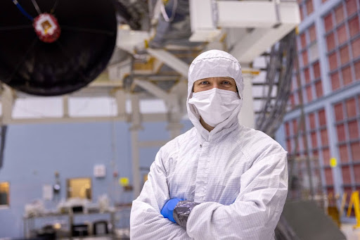 Scott Wiessinger stands in the Goddard clean room